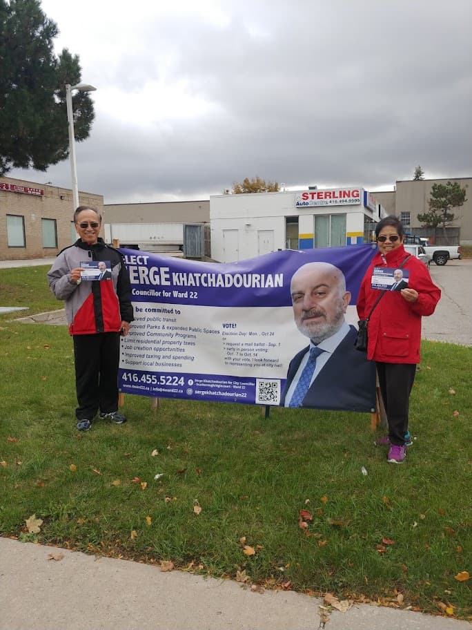 Volunteers holding a Serge Khatchadourian campaign banner in Scarborough