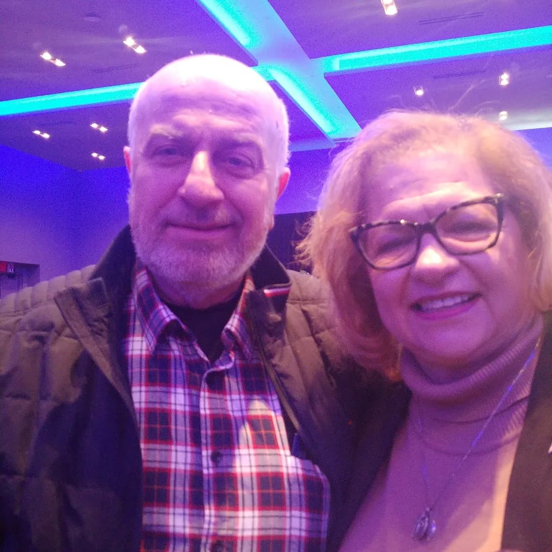 Serge Khatchadourian with a community member at a local event