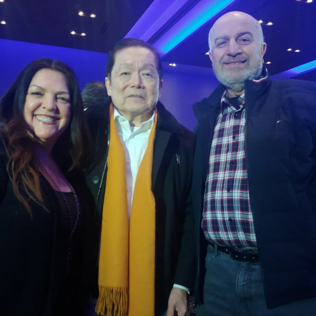 Serge Khatchadourian with community members at an evening event