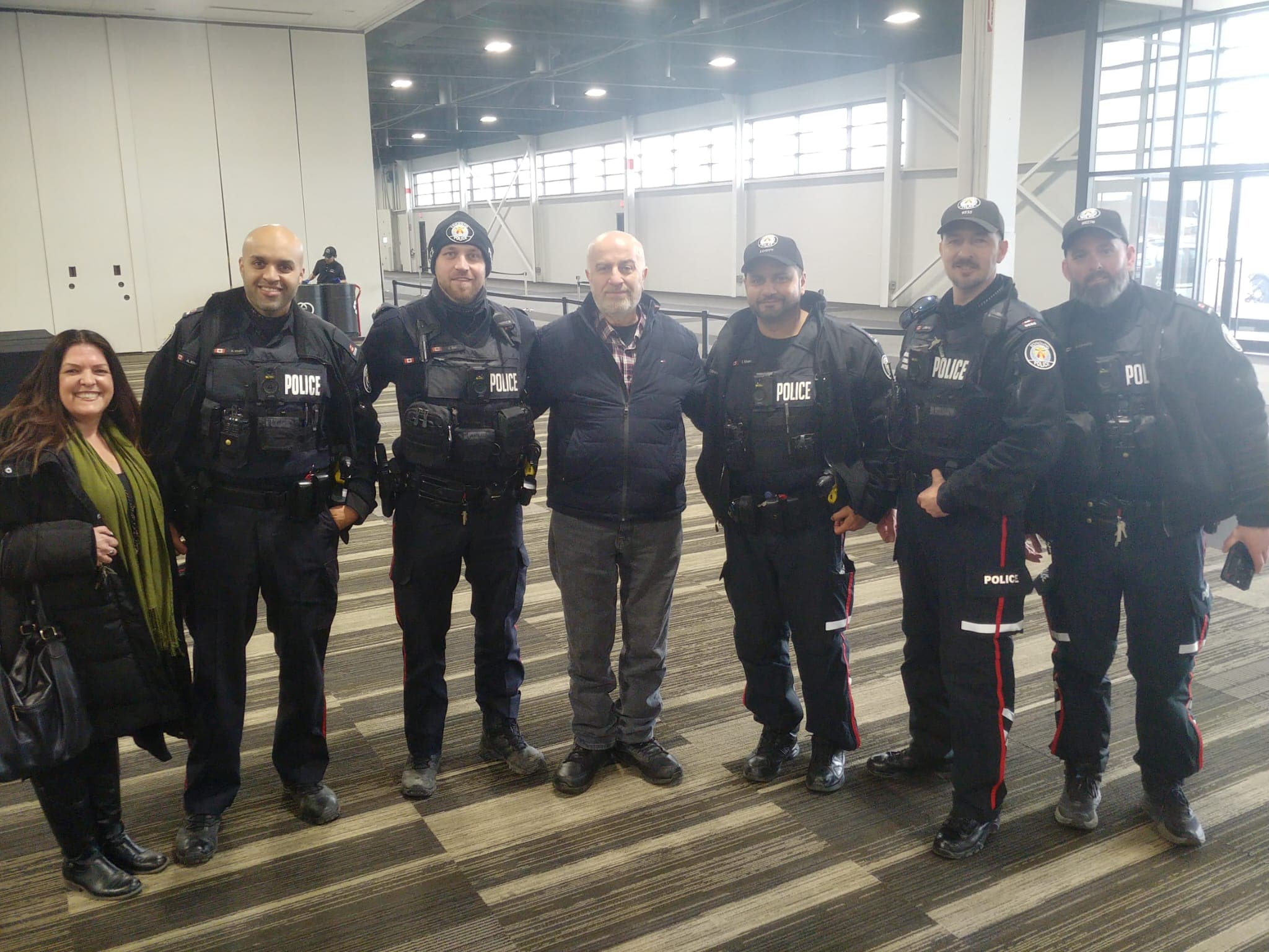 Serge Khatchadourian with Toronto Police officers at a community event