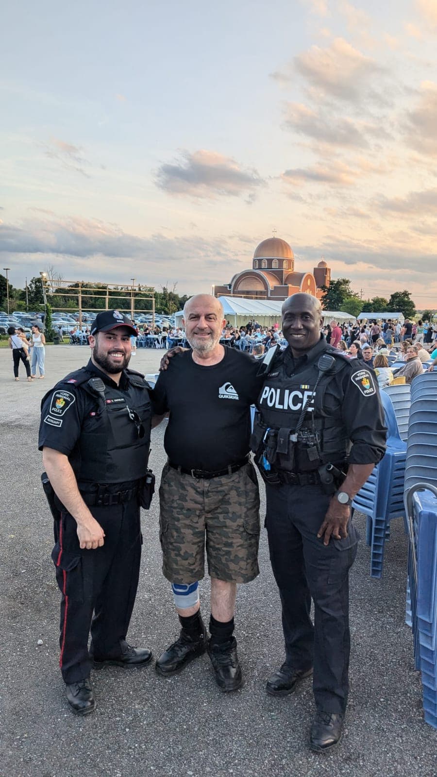 Serge Khatchadourian with York Regional Police officers at an outdoor community festival